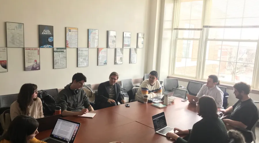 Researchers discussing or presenting R&D projects