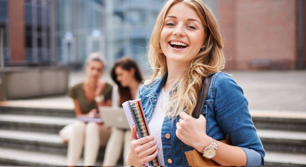Globe or students holding passports symbolizing overseas education