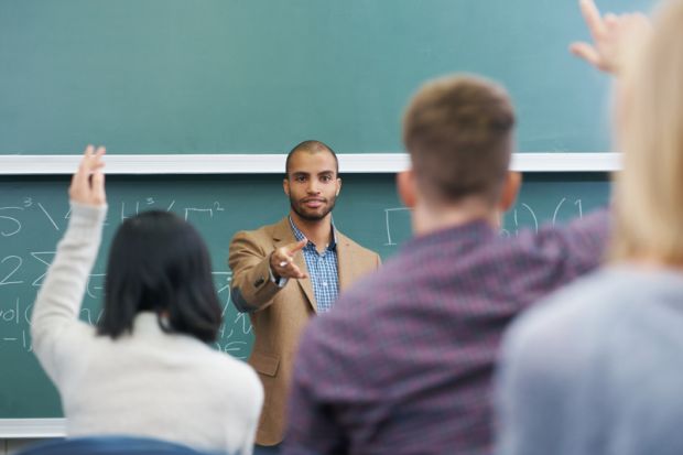 Faculty members attending seminar or lecture